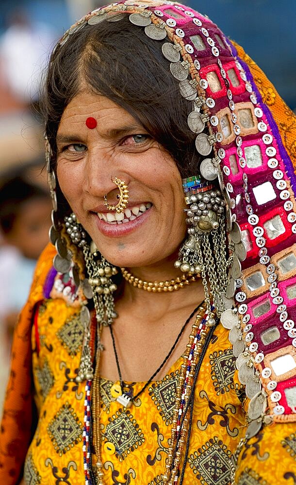 Smiling Lambani Gypsy woman with gold nose ring Tribal forest dwellers now settled in 30-home rural hamlets Related to the Rabaris gypsies of Kutch Gujarat, People, Karnataka, India