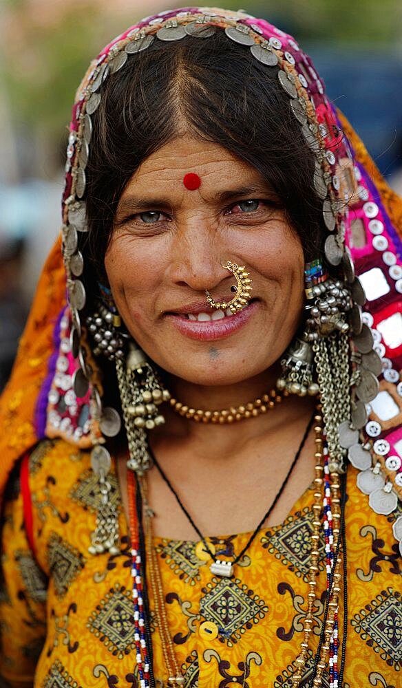 Smiling Lambani Gypsy Tribal woman wearing gold nose ring Forest dwellers now settled in 30-home rural hamlets Related to the Rabaris gypsies of Kutch Gujarat, People, Karnataka, India