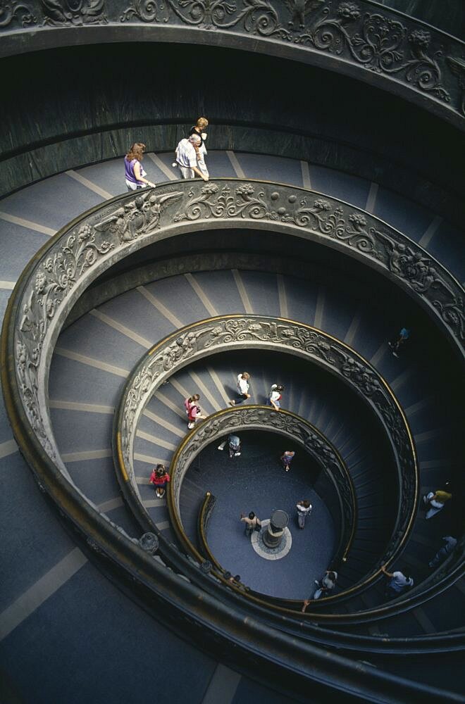 ITALY Rome   Vatican City The spiral staircase in the Vatican Museum with tourists descending the stairs