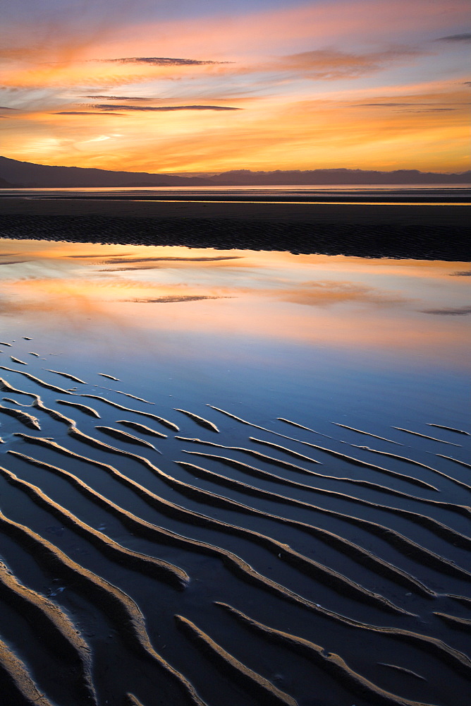 Sunset and sand ripples on Pohara Beach in Golden Bay, South Island, New Zealand, Pacific