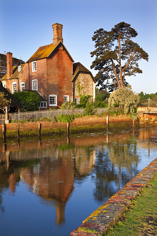 The 16th century Mill House beside Beaulieu River, New Forest, Hampshire, England, United Kingdom, Europe