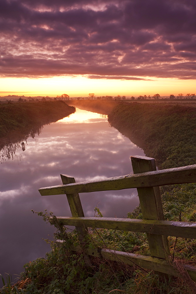 Sunrise over the River Brue near Glastonbury, Somerset Levels, Somerset, England, United Kingdom, Europe