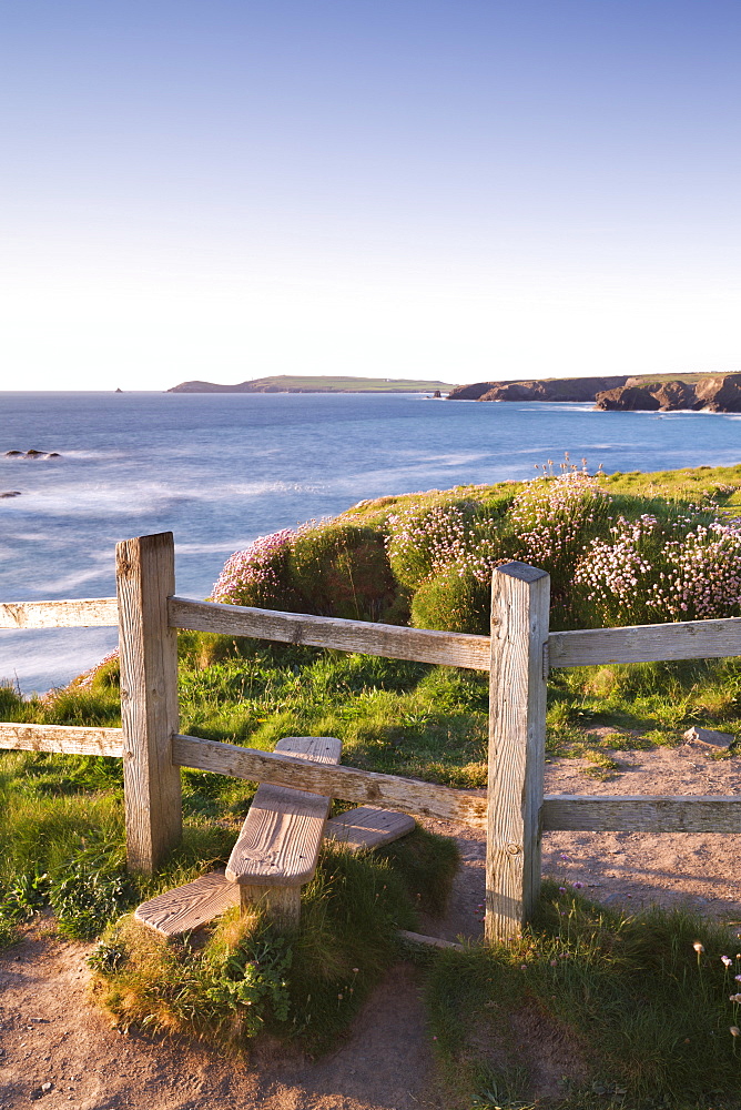 Wooden stile on Cornish clifftops near Porthcothan Bay with views to Trevose Head, Cornwall, England, United Kingdom, Europe