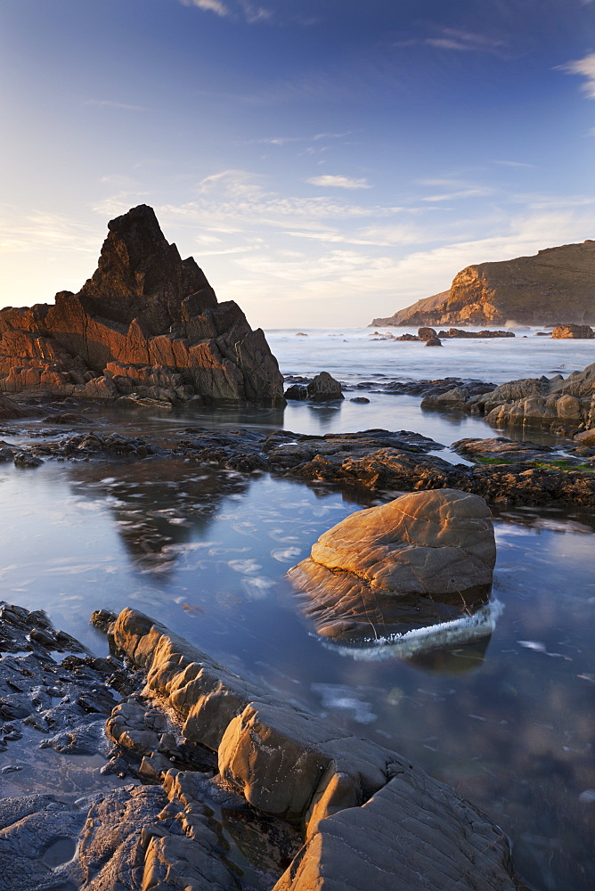 Rockpools and jagged rocks at Duckpool beach in North Cornwall, England, United Kingdom, Europe