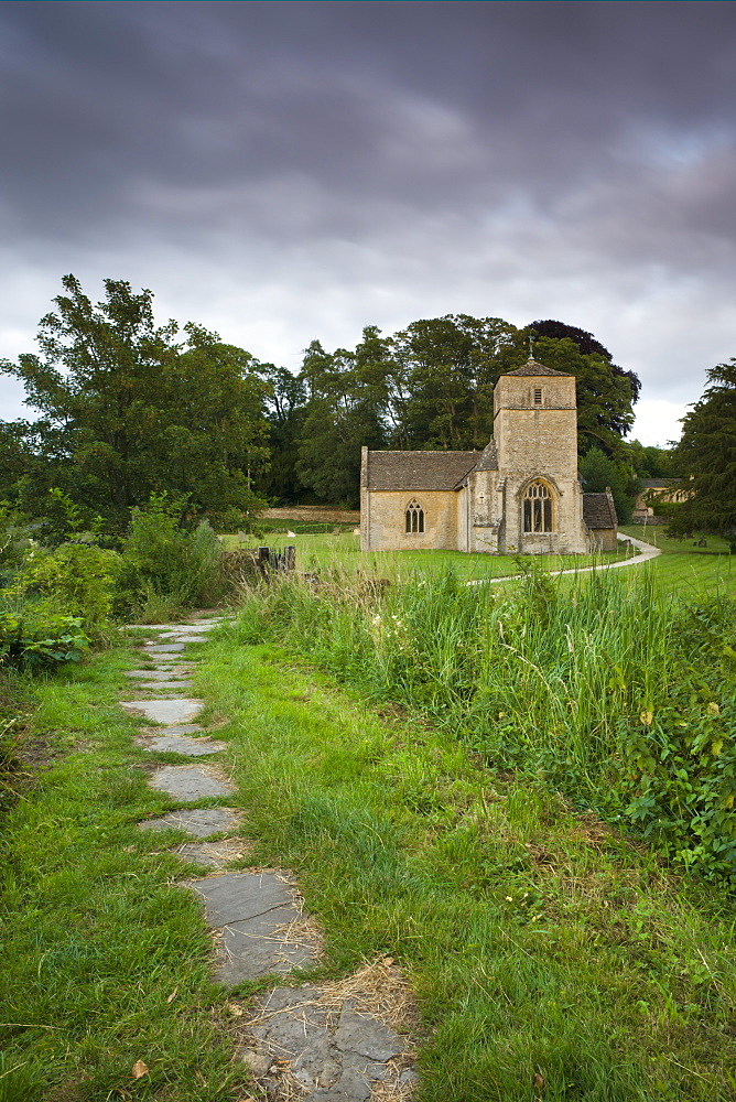 Footpath beside the River Leach leading to Eastleach Martin Church in the Cotswolds, Gloucestershire, England, United Kingdom, Europe 