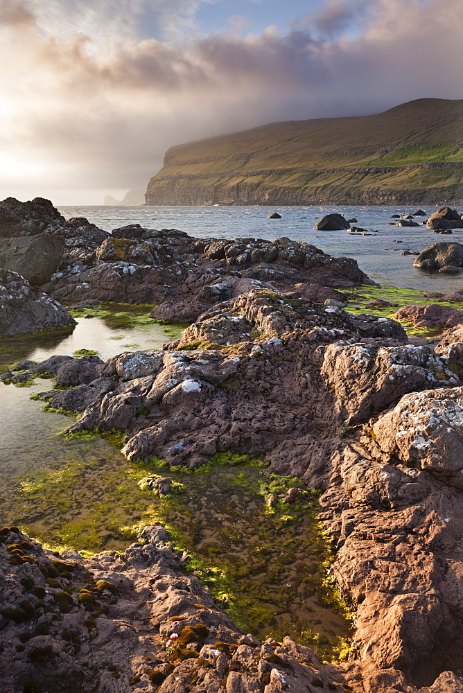 Rockpools on the foreshore on the west coast of Sandoy, Faroe Islands, Denmark, Europe 