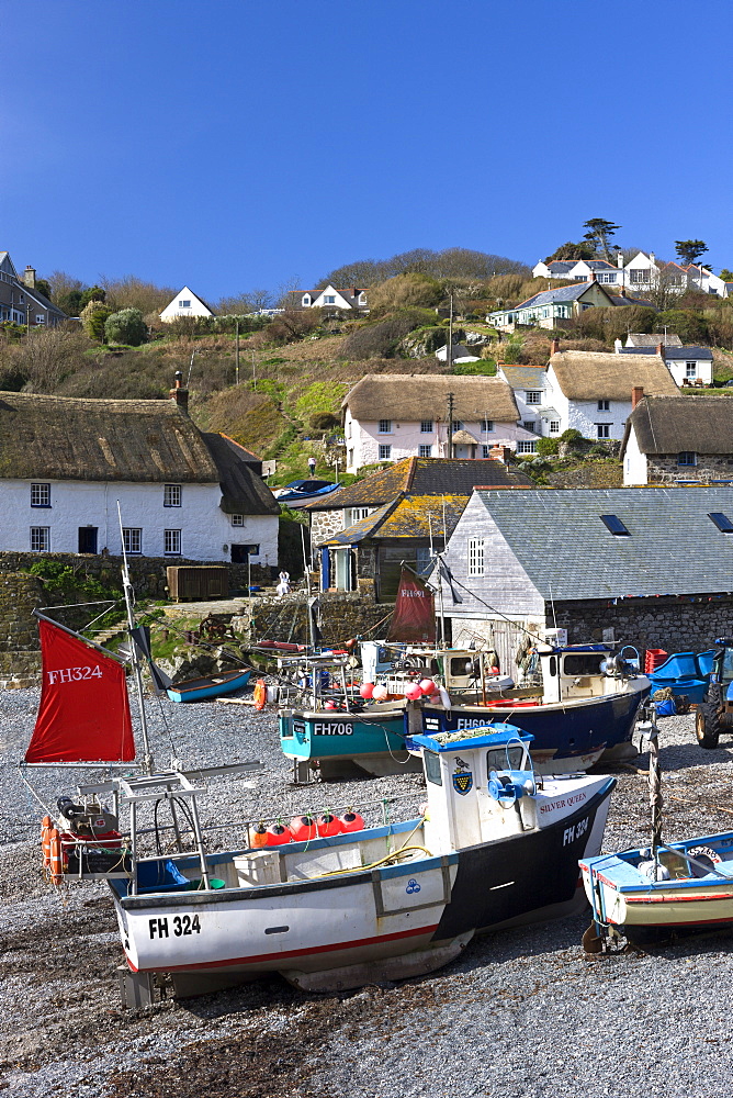 Fishing boats pulled onshore in the pretty Cornish fishing village of Cadgwith, Cornwall, England, United Kingdom, Europe