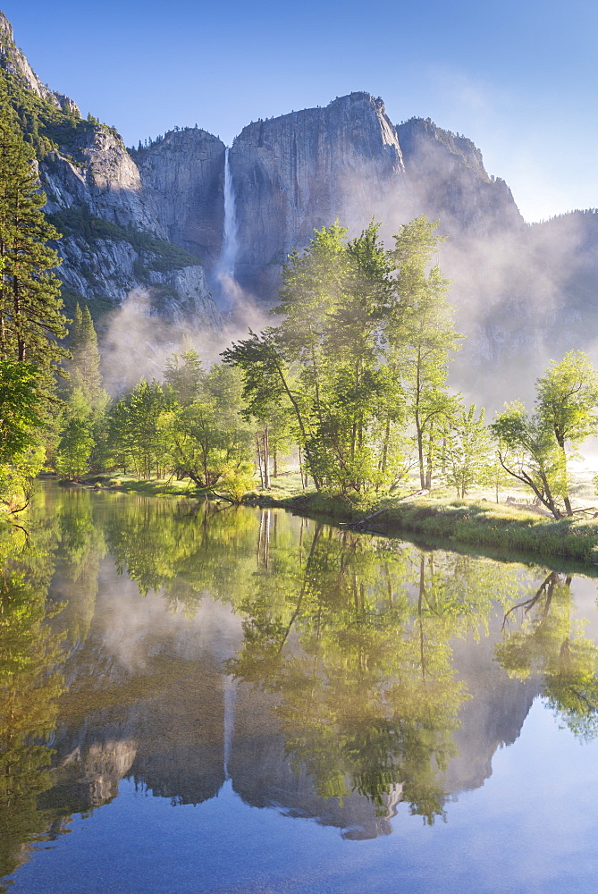 Yosemite Falls reflected in the Merced River at dawn, Yosemite National Park, UNESCO World Heritage Site, California, United States of America, North America