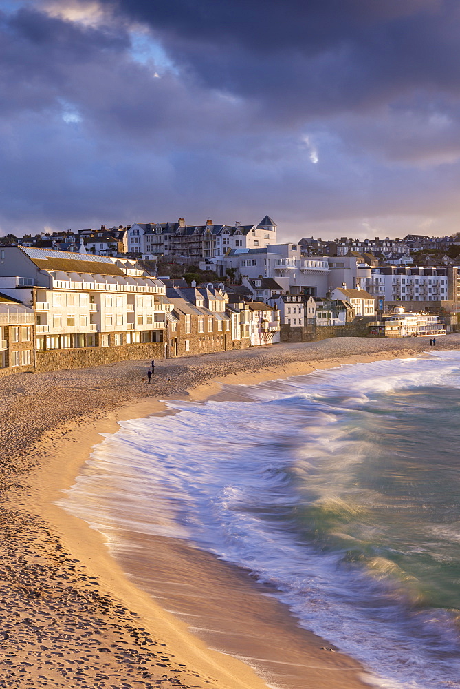 Waves crash against Porthmeor Beach in St. Ives, Cornwall, England, United Kingdom, Europe