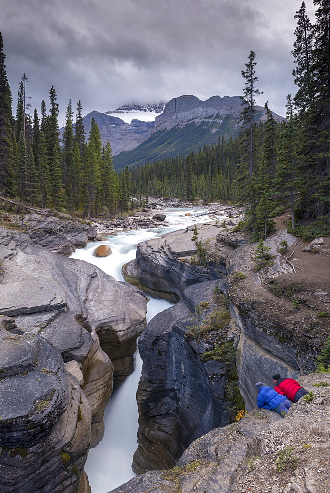 Man and woman gazing down into Mistaya Canyon in the Canadian Rockies, Banff National Park, UNESCO World Heritage Site, Alberta, Canada, North America