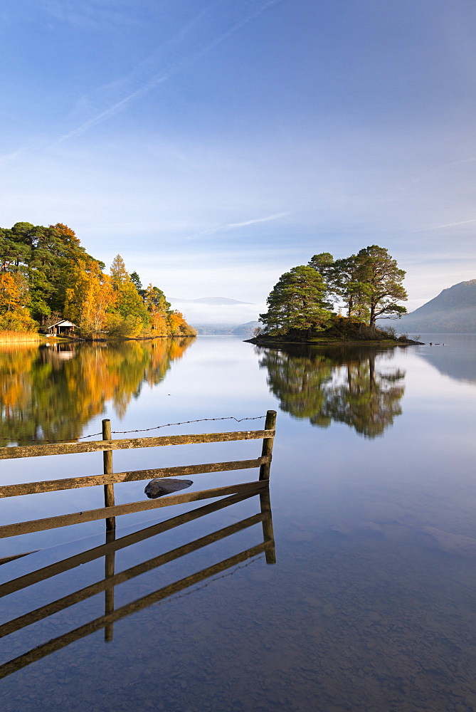 Mirror still tranquil morning on Derwent Water in the Lake District, Cumbria, England, United Kingdom, Europe