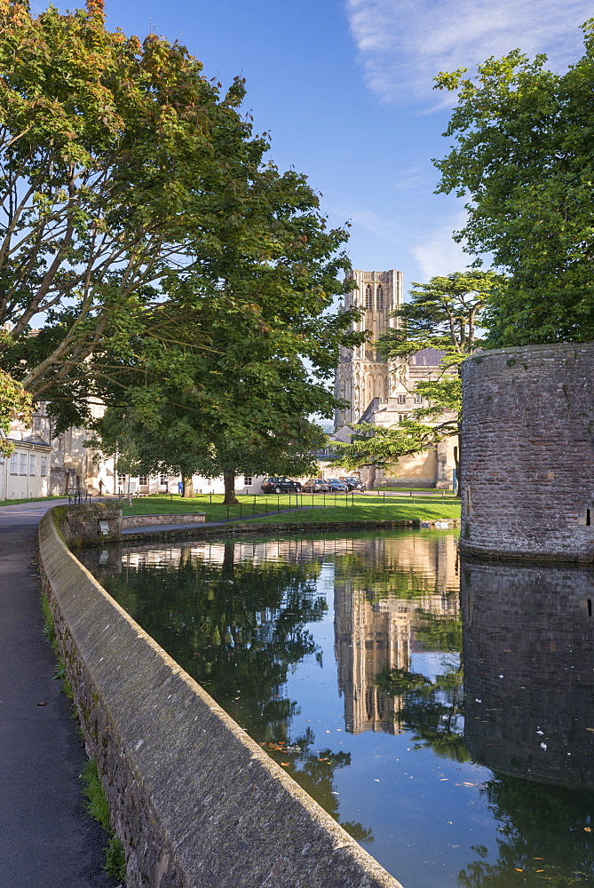 Wells Cathedral reflected in the Bishop's Palace moat, Wells, Somerset, England, United Kingdom, Europe