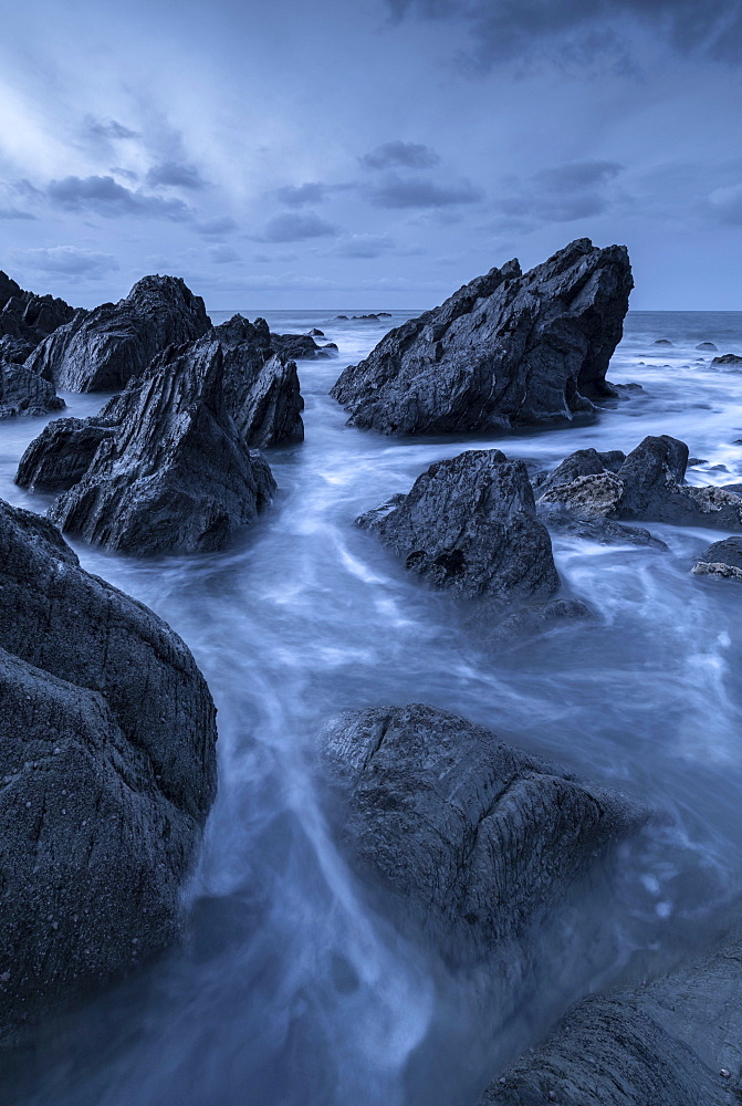 Rocky coastline at dusk, North Devon, England, United Kingdom, Europe