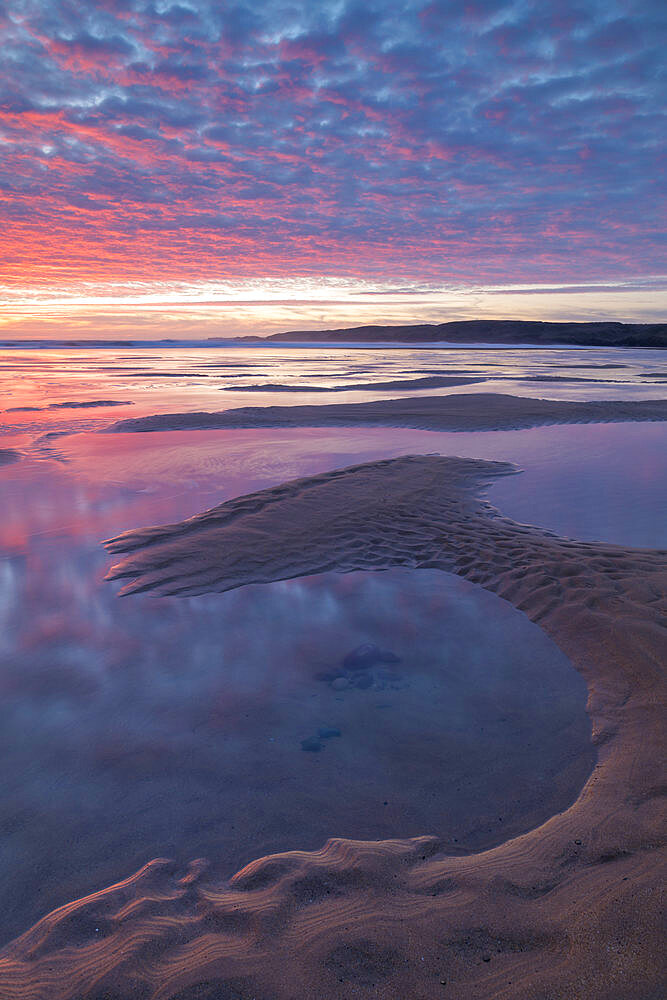 Beautiful sunset over the beach at Freshwater West in Pembrokeshire Coast National Park, Wales, United Kingdom, Europe