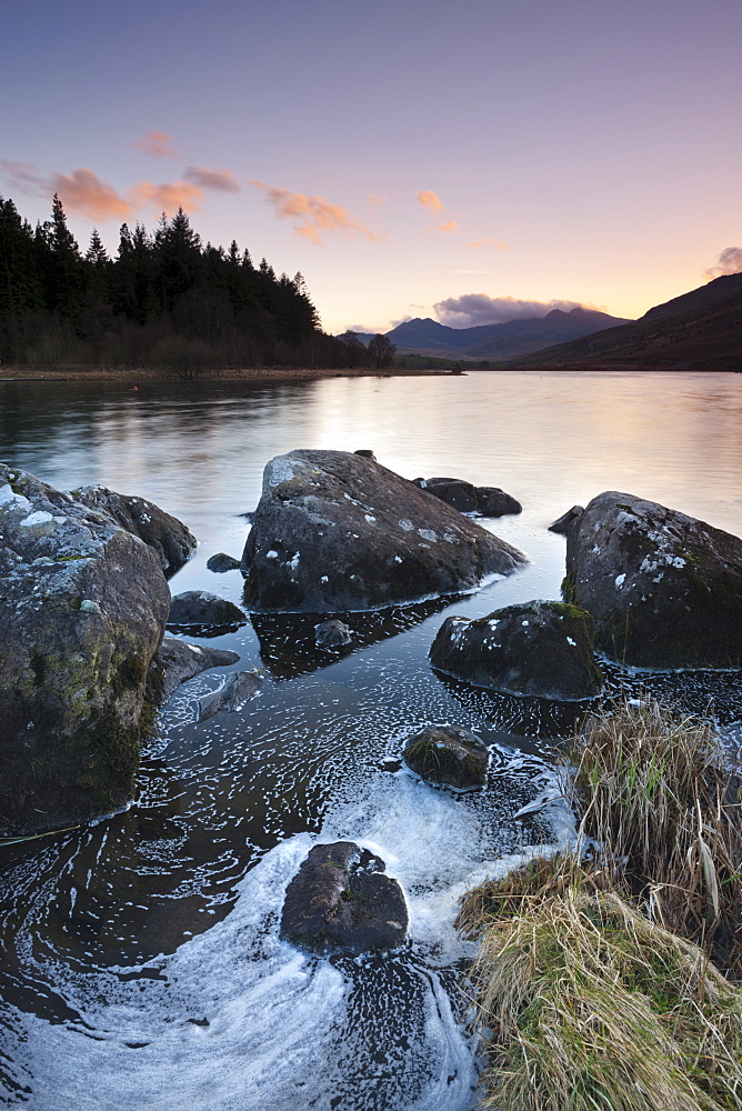 Mount Snowdon at dusk viewed from the rocky shores of Llynnau Mymbyr, Snowdonia National Park, Wales, United Kingdom, Europe