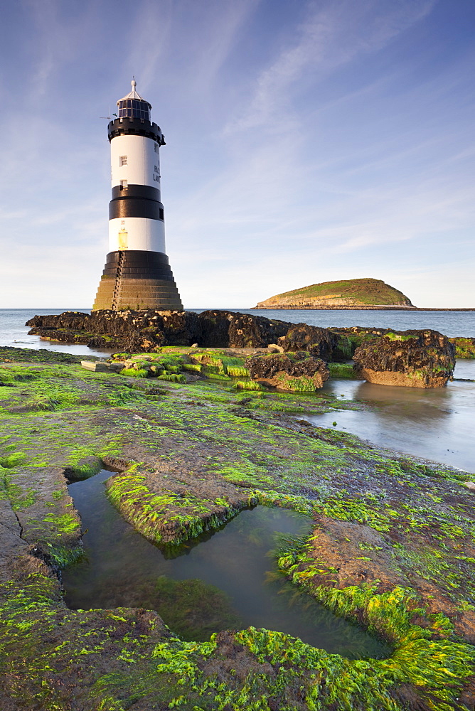 Penmon Point lighthouse and Puffin Island on the east coast of Anglesey, North Wales, Wales, United Kingdom, Europe