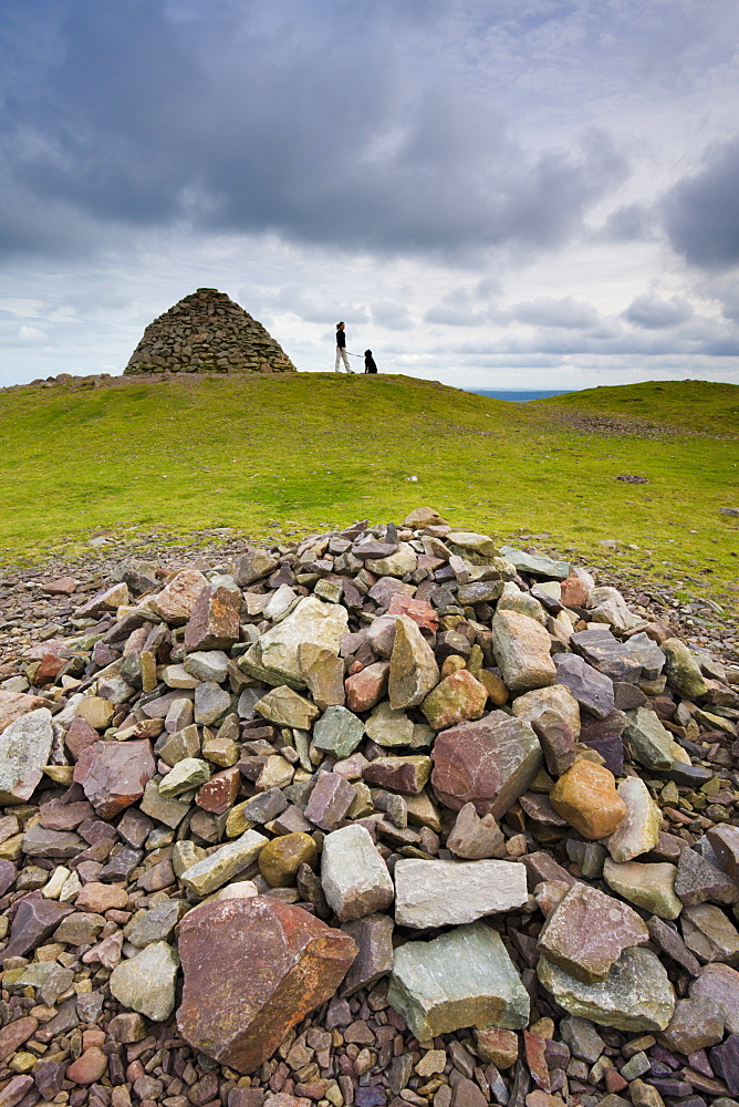 Stone cairns and dogwalker at Dunkery Beacon in Exmoor National Park, Somerset, England, United Kingdom, Europe