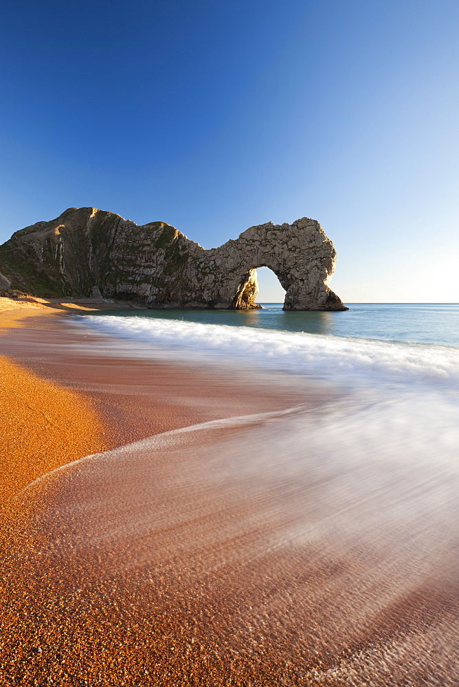 Waves break onto Durdle Door beach in winter, Jurassic Coast, UNESCO World Heritage Site, Dorset, England, United Kingdom, Europe