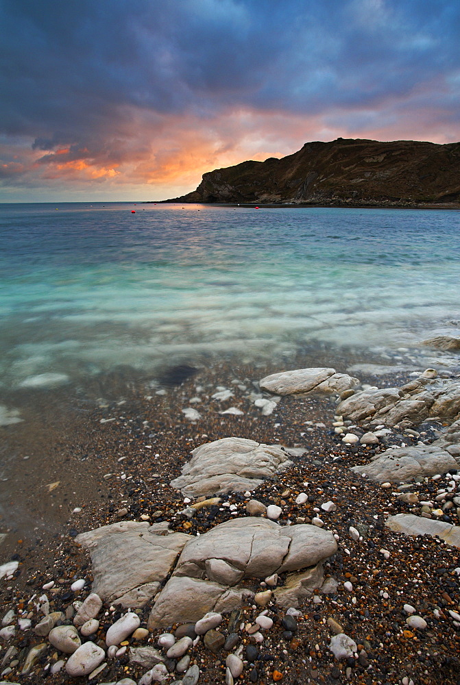 Sunset over the circular bay at Lulworth Cove, Jurassic Coast, UNESCO World Heritage Site, Dorset, England, United Kingdom, Europe