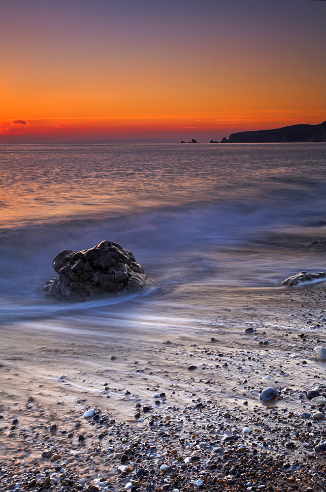 Sunset on the pebbly beach at Worbarrow, Jurassic Coast, UNESCO World Heritage Site, Dorset, England, United Kingdom, Europe