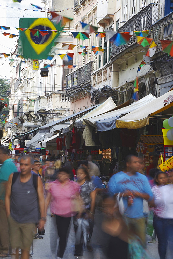 People walking along pedestrianised street of Saara district, Centro, Rio de Janeiro, Brazil, South America 