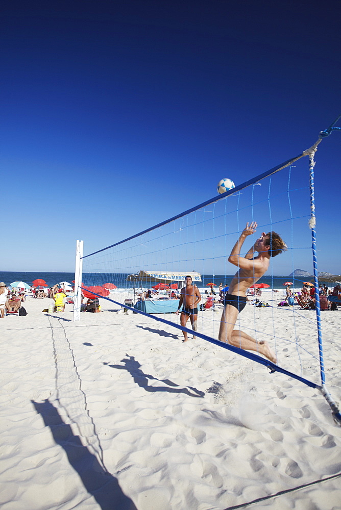 Men playing foot volley (futevolei) on Copacabana beach, Rio de Janeiro, Brazil, South America 