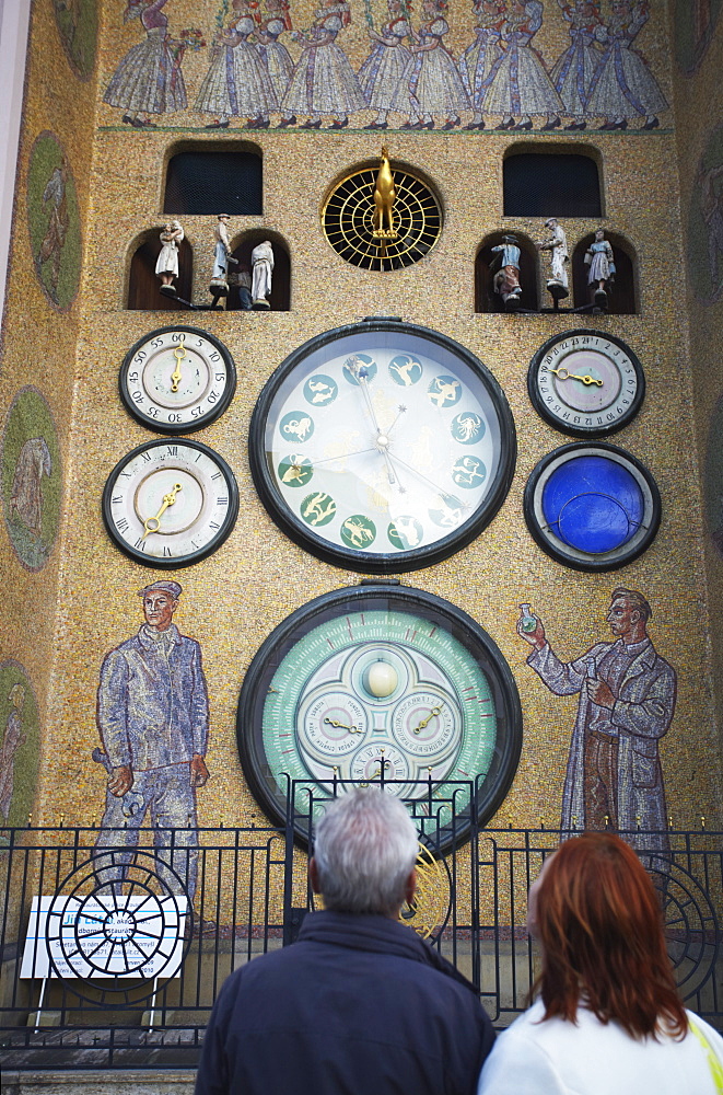 People looking at Astronomical Clock on Town Hall In Upper Square (Horni Namesti), Olomouc, Moravia, Czech Republic, Europe