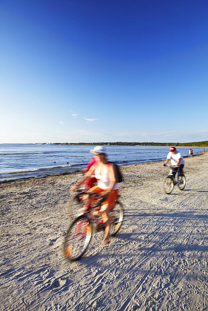 Cyclists on Pirita Beach, Tallinn, Estonia, Baltic States, Europe