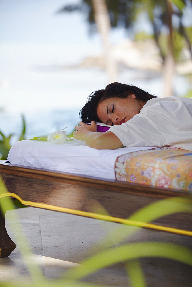 Woman relaxing on massage bed at Melati Beach Resort and Spa, Ko Samui, Thailand, Southeast Asia, Asia