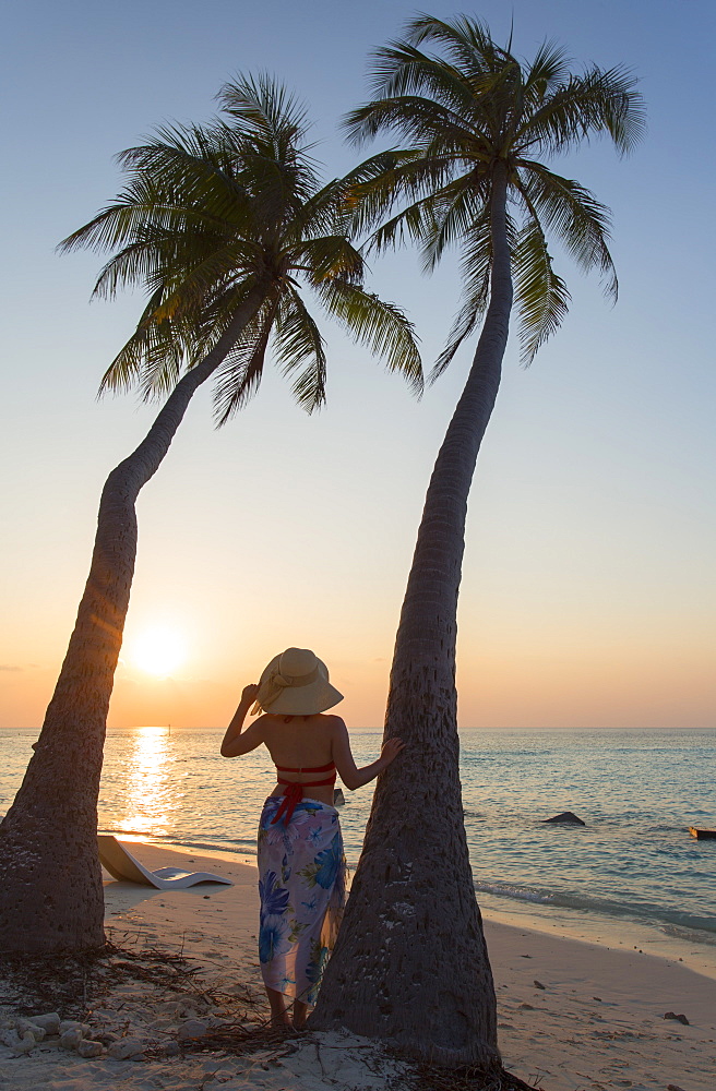 Woman on beach at sunset, Maafushi Island, Kaafu Atoll, Maldives, Indian Ocean, Asia