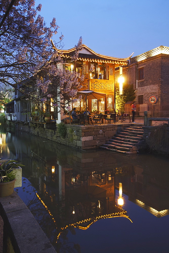 Teahouse at dusk along canal, Suzhou, Jiangsu, China, Asia