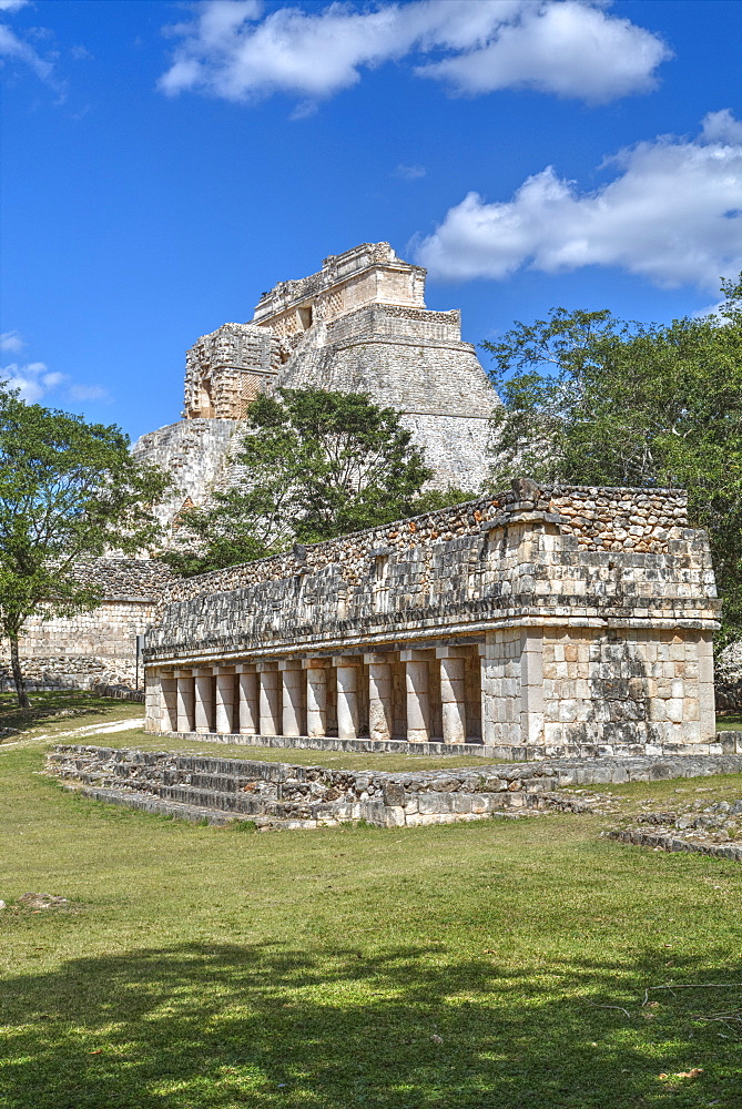 Columns Building in foreground with Pyramid of the Magician beyond, Uxmal, Mayan archaeological site, UNESCO World Heritage Site, Yucatan, Mexico, North America