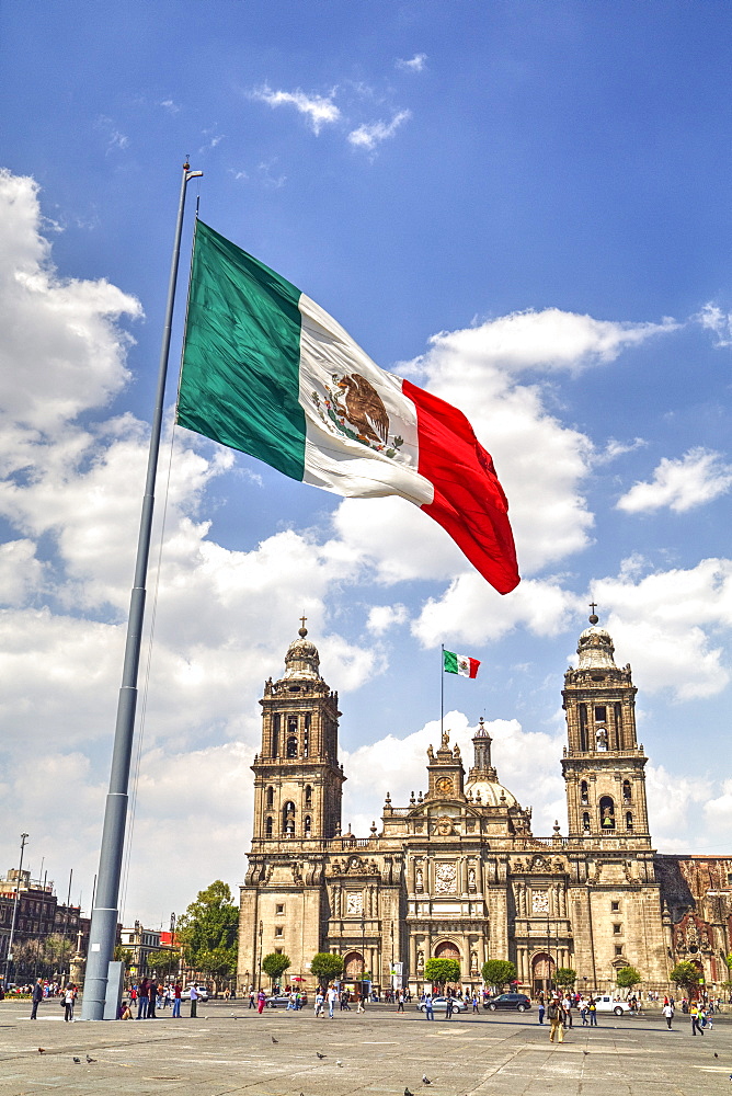 Mexican flag, Plaza of the Constitution (Zocalo), Metropolitan Cathedral in background, Mexico City, Mexico D.F., Mexico, North America