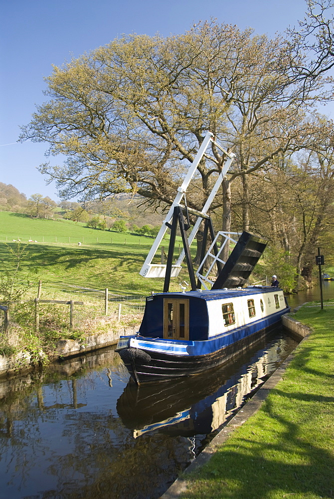 Narrow boat passing through a lift bridge, Llangollen Canal, Wales, United Kingdom, Europe