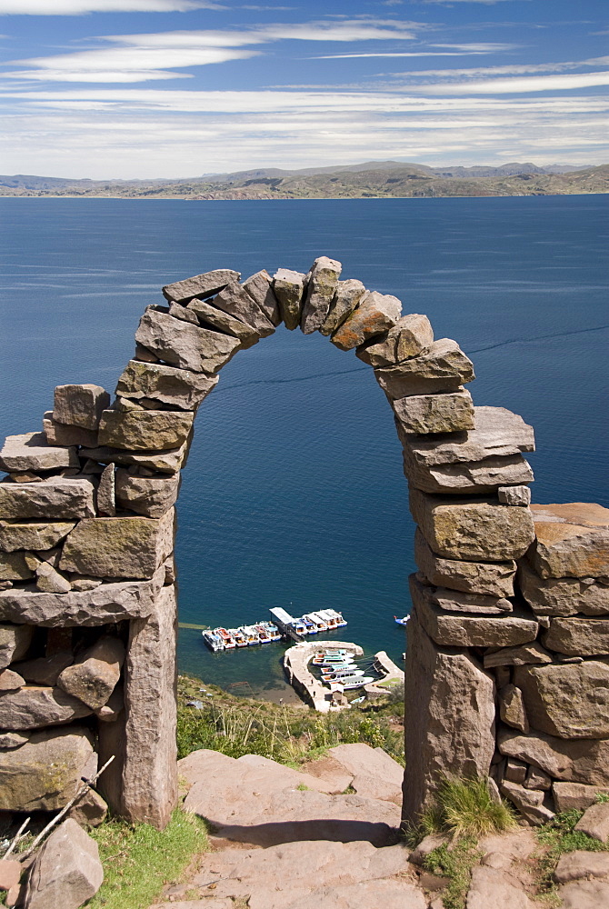 Old stone archway leading to the central village , Isla Taquille, Lake Titicaca, Peru, South America