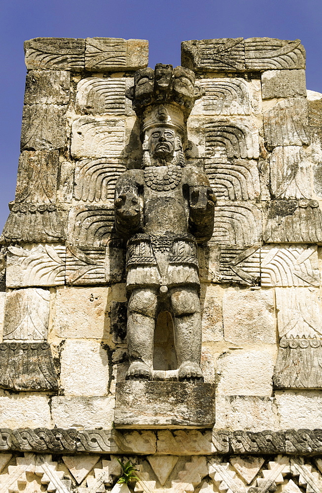 Stone carved Atlantes figures on the back of the Mayan ruins of El Palacio de las Mascarones at Kabah, in the Yucatan, Mexico, North America 