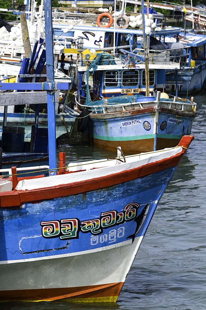 Brightly coloured fishing boat at Negombo lagoon, Negombo, Sri Lanka, Asia