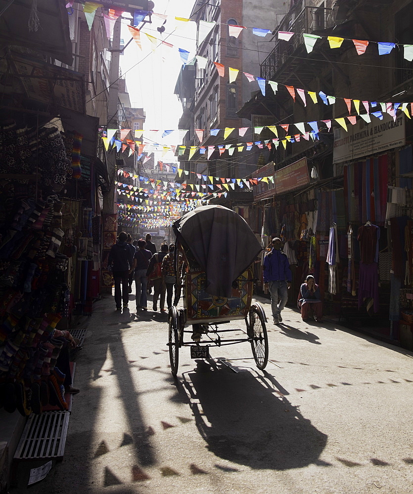 A rickshaw driving through the streets of Kathmandu, Nepal, Asia