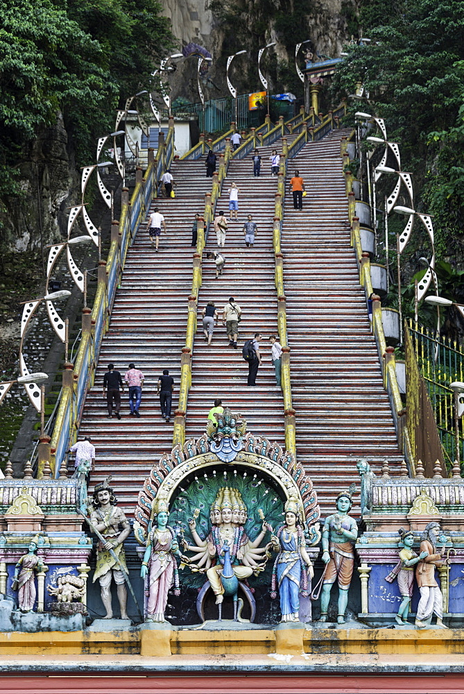 Pilgrims and tourists walking up the steep steps to the Batu Caves, Gombak, Malaysia, Southeast Asia, Asia