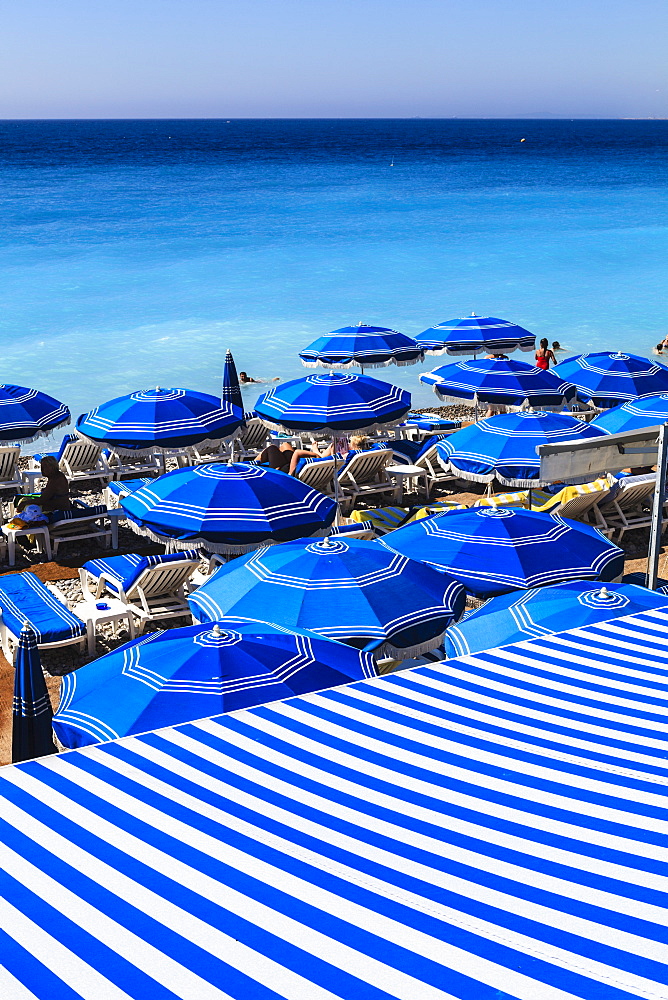 Beach parasols, Nice, Alpes Maritimes, Provence, Cote d'Azur, French Riviera, France, Europe