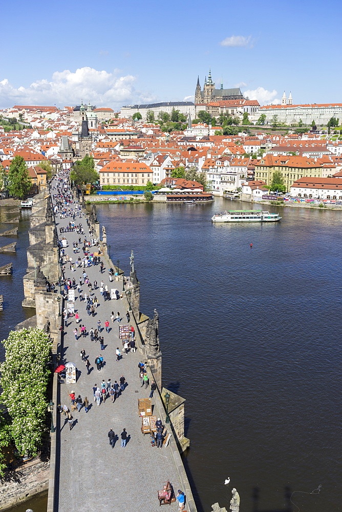 High angle view of Charles Bridge looking towards the Castle District, Royal Palace and St. Vitus's Cathedral, UNESCO World Heritage Site, Prague, Czech Republic, Europe