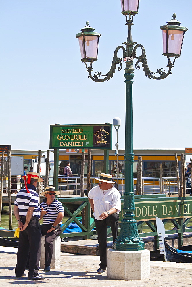 Gondoliers chatting, Venice, Veneto, Italy, Europe