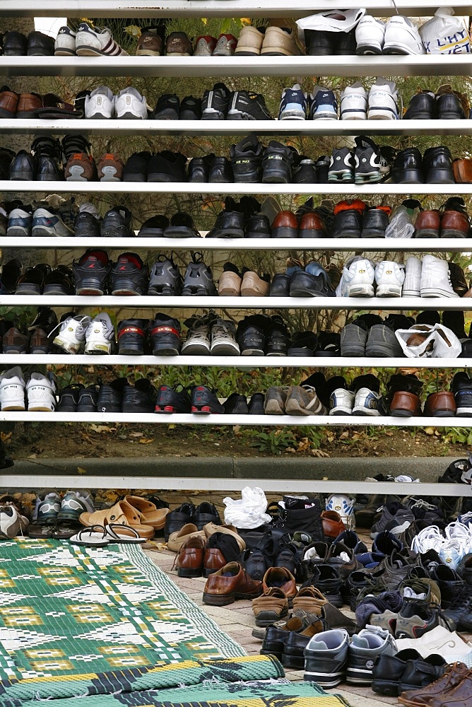 Shoes outside a mosque, Lyon, Rhone Alpes, France, Europe