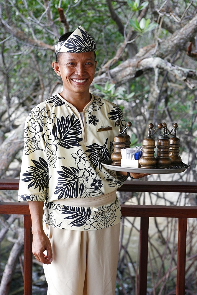 Indonesian waiter at the Banyan Tree hotel, Bintan, Indonesia, Southeast Asia, Asia