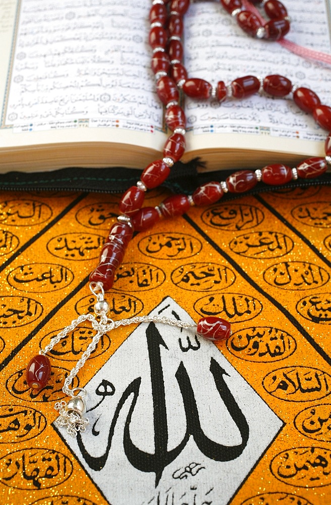 Koran, rosary and Allah calligraphy, Paris, France, Europe