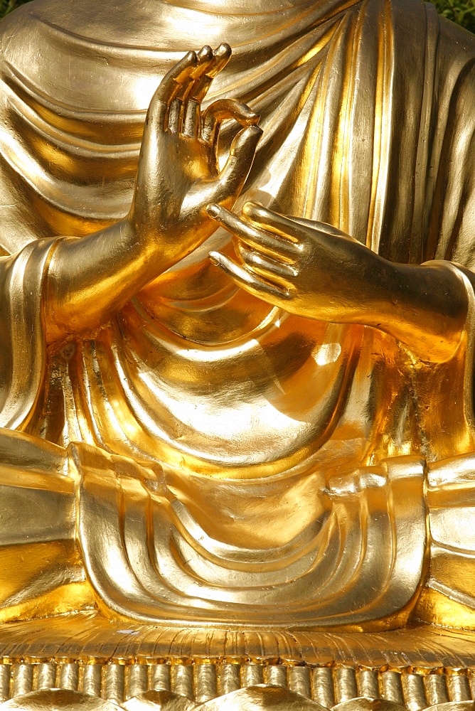 Detail of the teaching mudra on the sitting Buddha statue, Sainte-Foy-Les-Lyon, Rhone, France, Europe