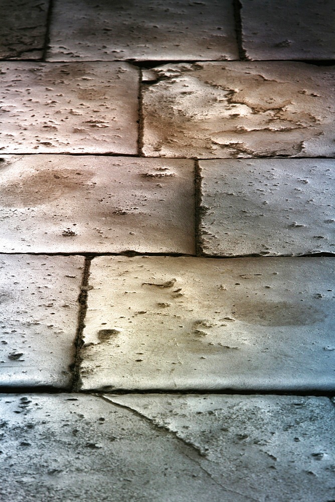 Paving stones in Saint Chef Abbey church, Saint-Chef-en-Dauphine, Isere, France, Europe