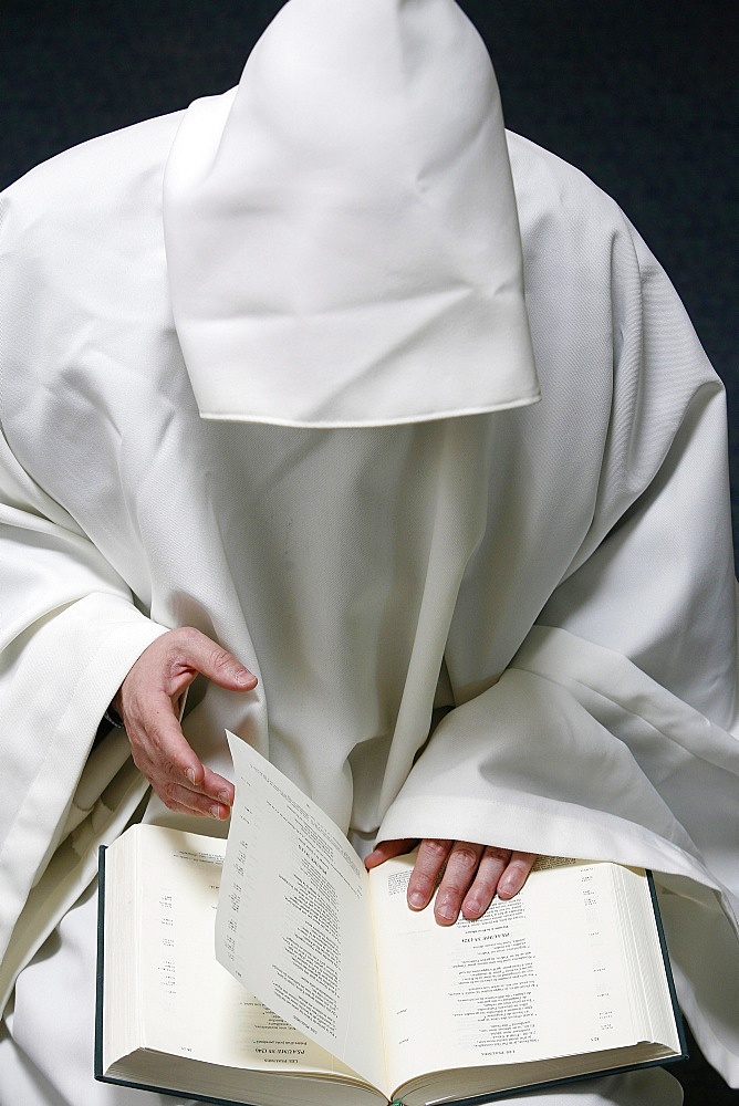 Monk reading the Bible, Evian, Haute Savoie, France, Europe