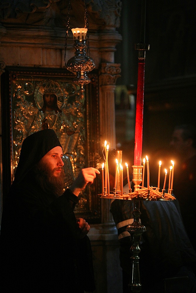 Orthodox monk in Aghiou Pavlou monastery church on Mount Athos, Greece, Europe