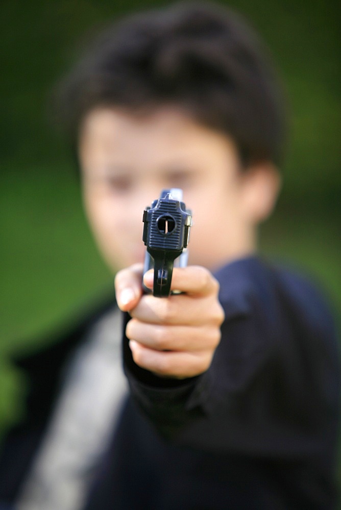 Boy with toy gun, Le Souillard, Eure, France, Europe